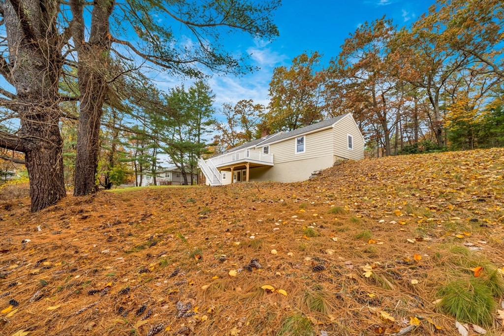11 Gould Road Andover, MA 01810 - Photo 28 of 31 a house with trees in front of it