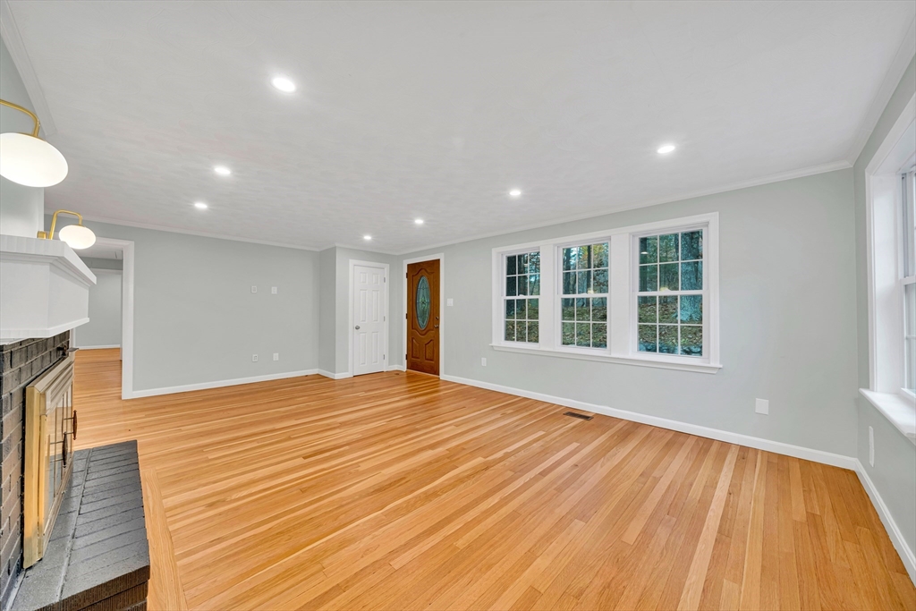 11 Gould Road Andover, MA 01810 - Photo 4 of 31 a view of empty room with wooden floor and fan
