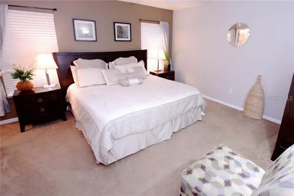 a bedroom with a bed and a couch