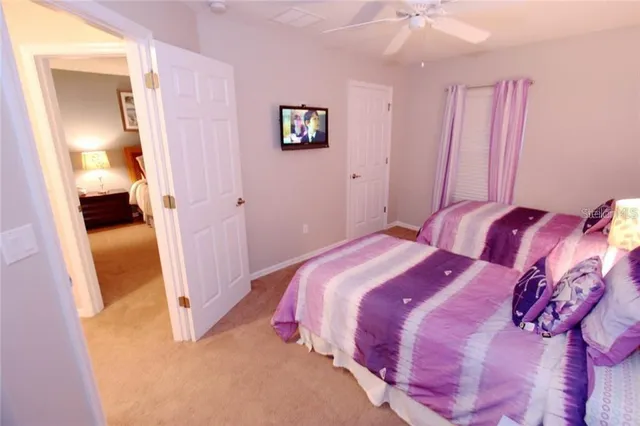 a bedroom with a bed and a walk in closet