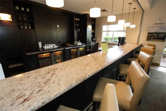 a large kitchen with granite countertop a counter top space