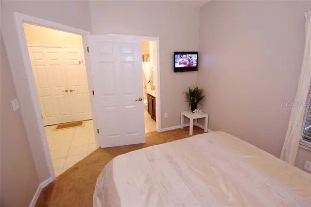 a bedroom with a bed and a cabinets