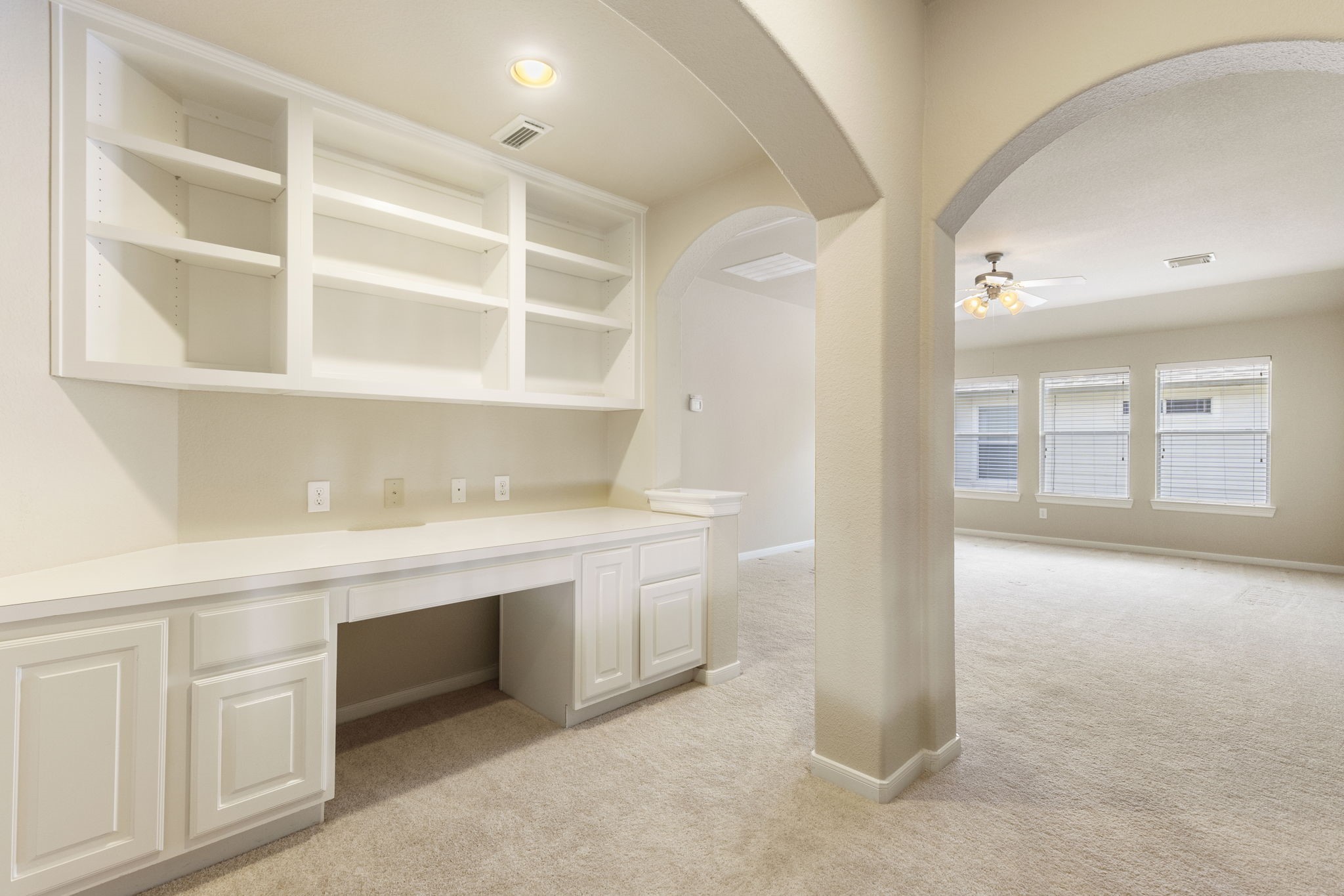 19222 Senterra Lakes Boulevard Spring, TX 77379 - Photo 23 of 45 At the top of the stairs you will be met with a convenient built-in home office nook or homework station, featuring a long desk workspace, upper cabinetry, and open shelving.