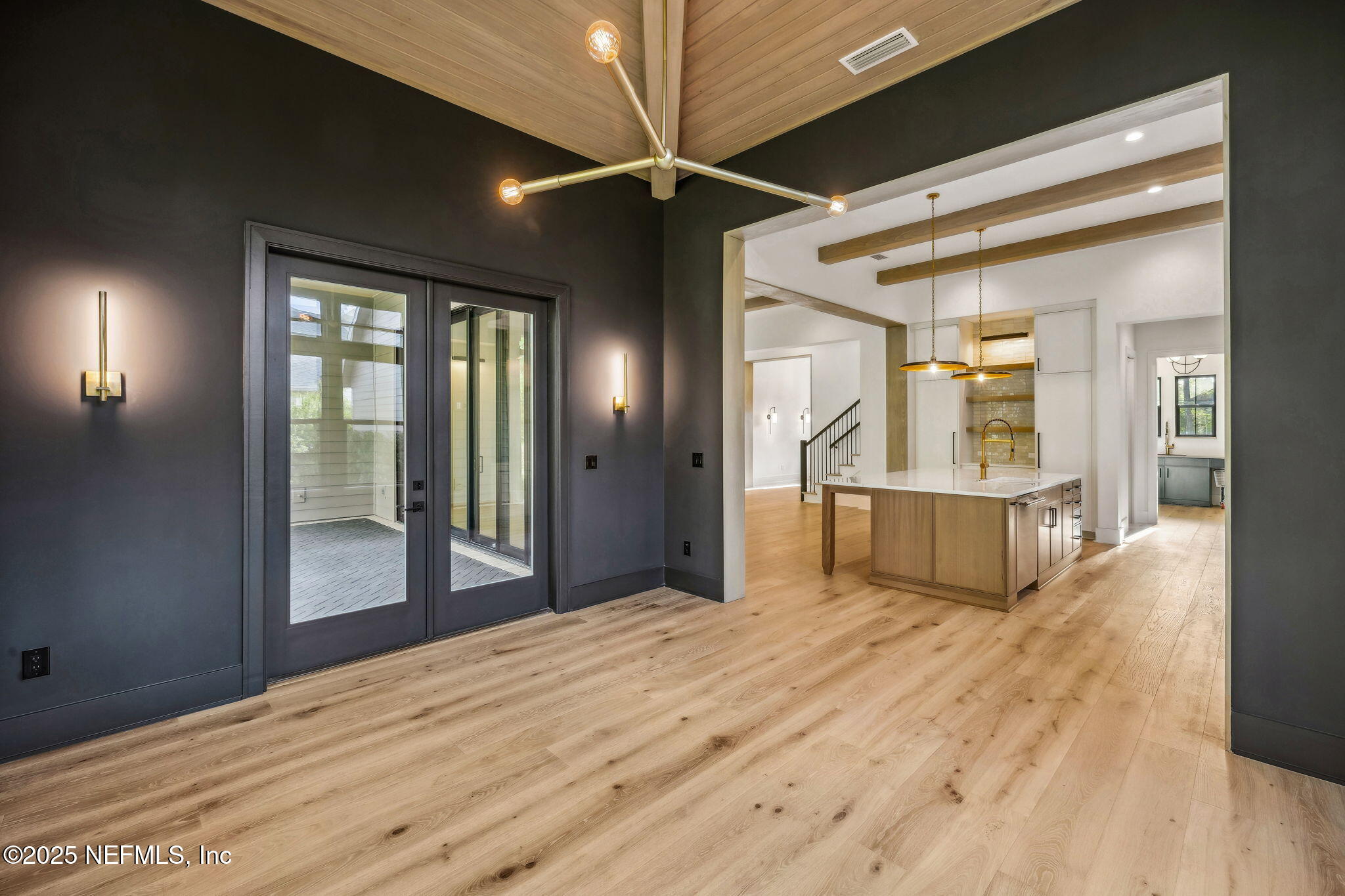 4650 Palm Valley Road Ponte Vedra Beach, FL 32082 - Photo 23 of 80 a view of a hallway with wooden floor and a bathroom