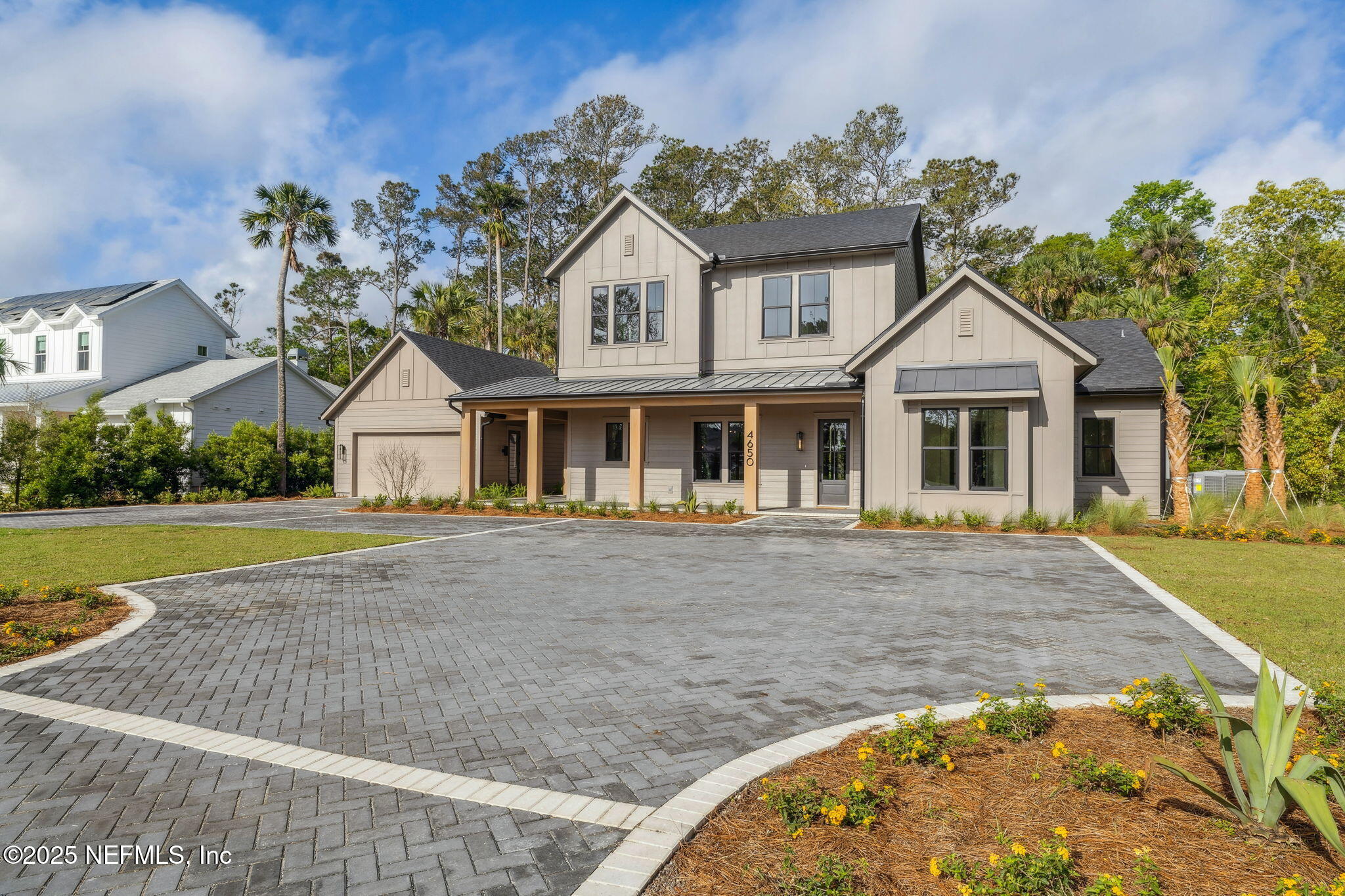 4650 Palm Valley Road Ponte Vedra Beach, FL 32082 - Photo 4 of 80 a front view of a house with garden