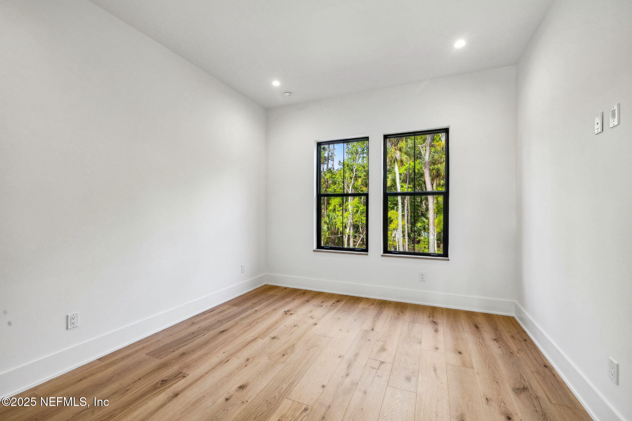 4650 Palm Valley Road Ponte Vedra Beach, FL 32082 - Photo 43 of 80 an empty room with wooden floor and windows