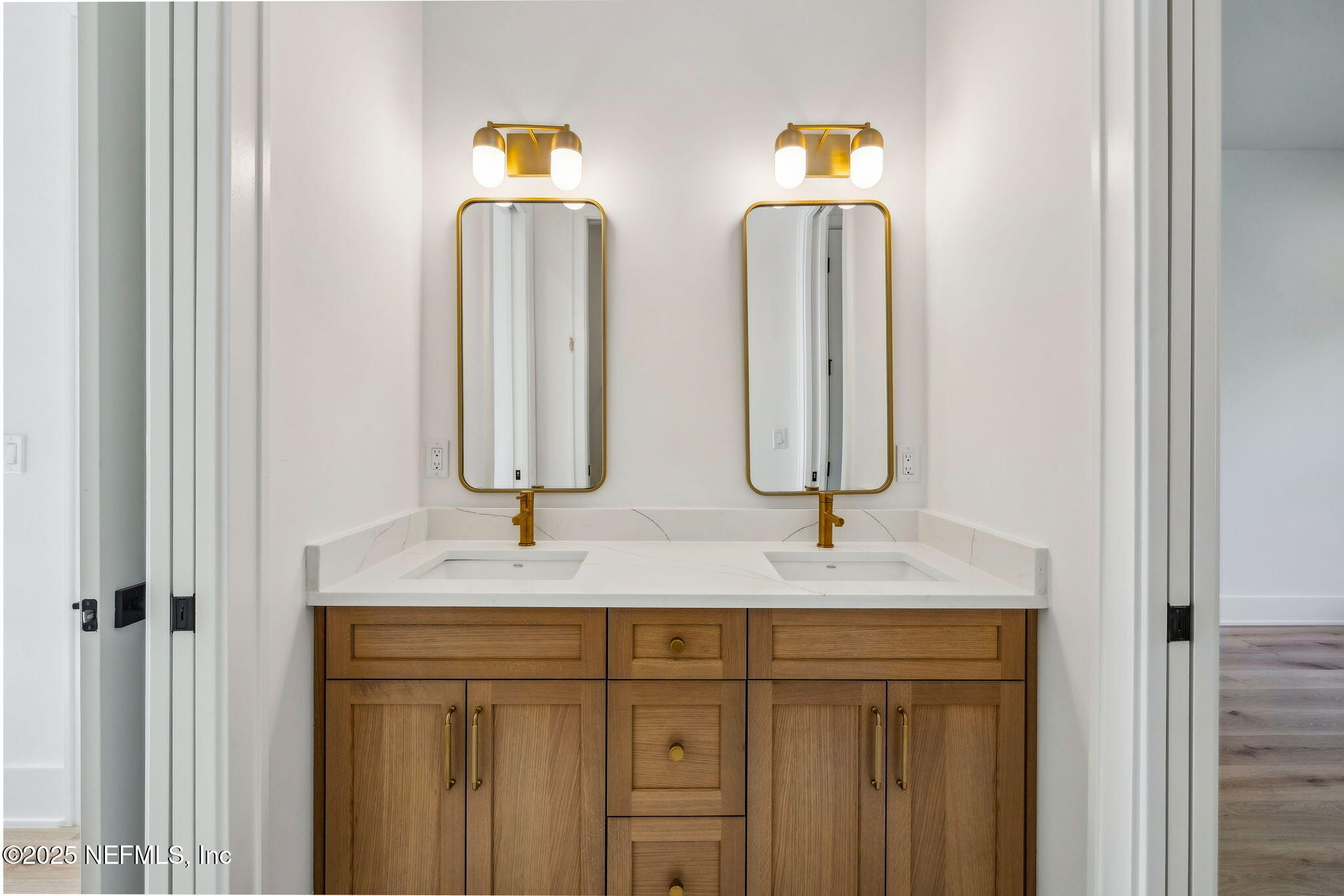 4650 Palm Valley Road Ponte Vedra Beach, FL 32082 - Photo 48 of 80 a bathroom with double vanity sinks and a mirror