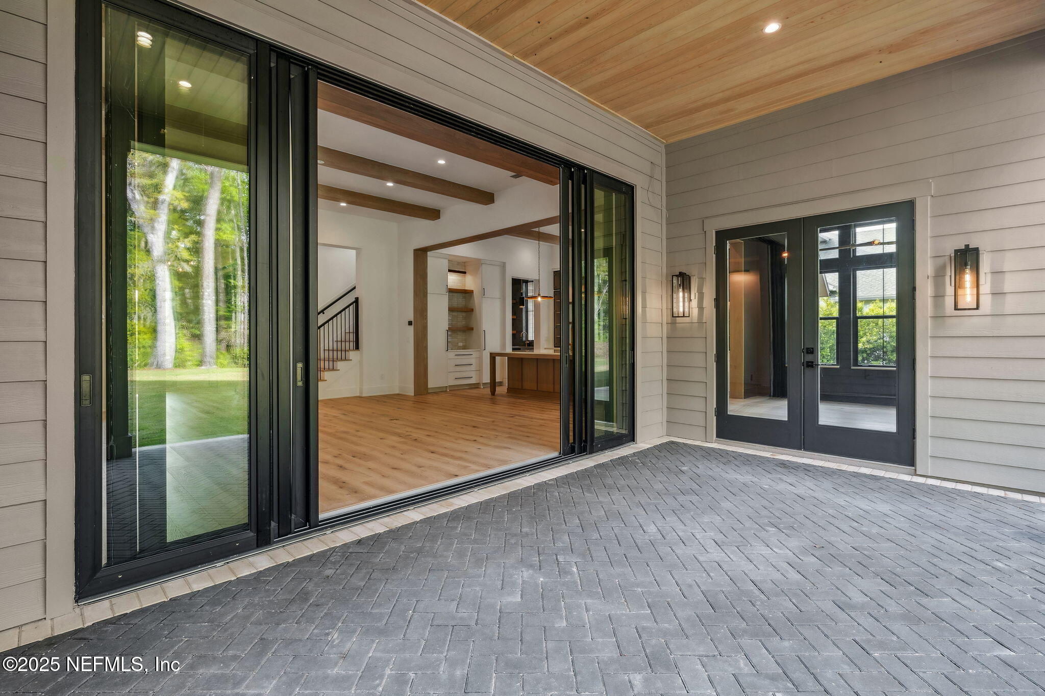 4650 Palm Valley Road Ponte Vedra Beach, FL 32082 - Photo 52 of 80 an empty room with floor to ceiling windows and floor to ceiling window
