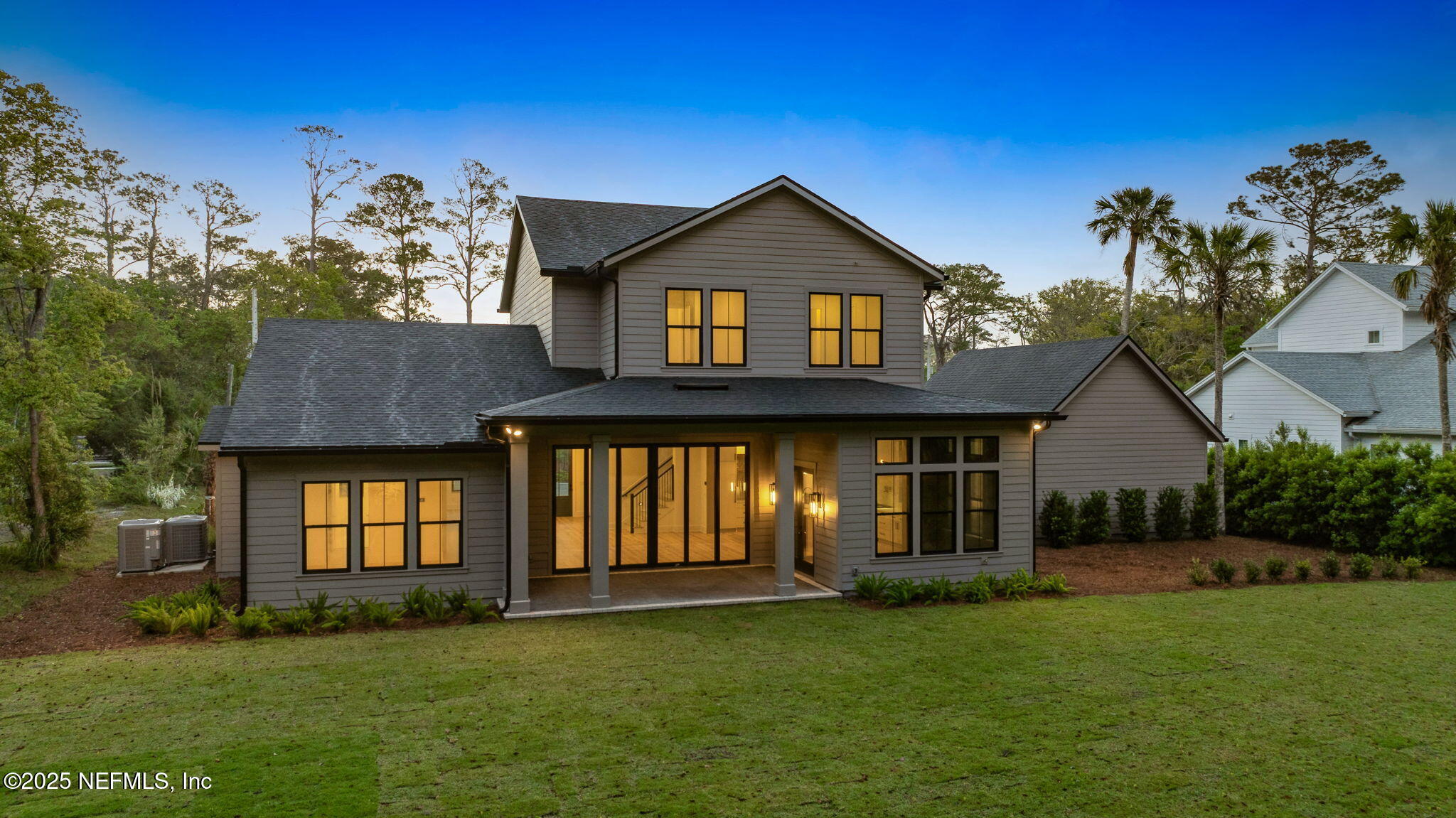 4650 Palm Valley Road Ponte Vedra Beach, FL 32082 - Photo 59 of 80 a front view of a house with a garden