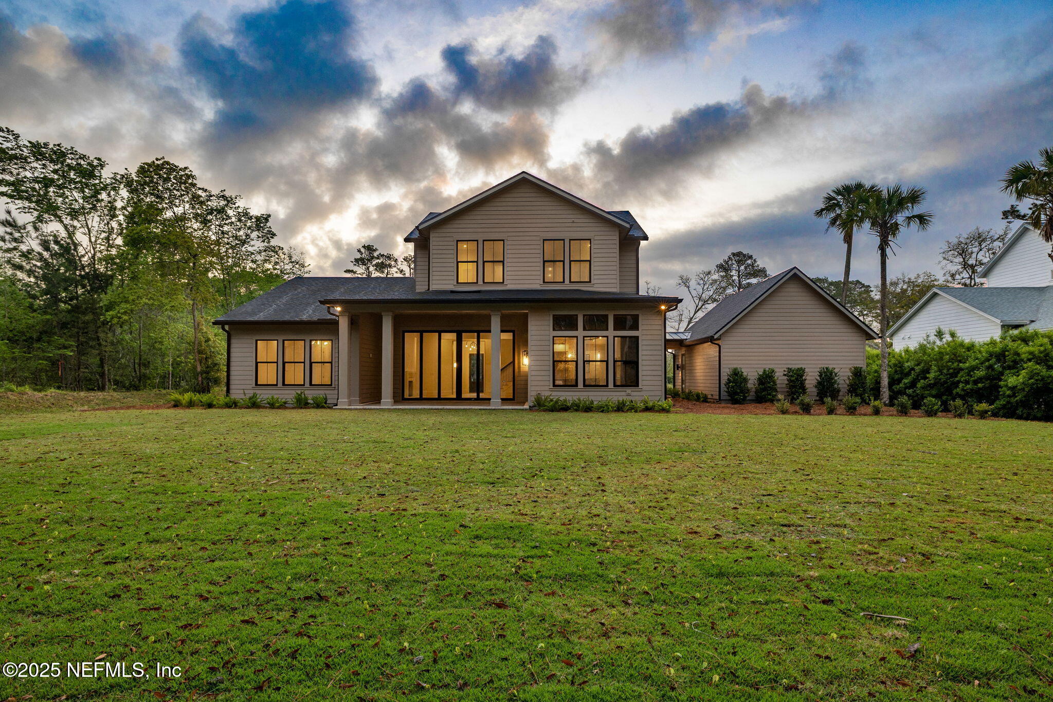 4650 Palm Valley Road Ponte Vedra Beach, FL 32082 - Photo 60 of 80 a front view of a house with garden