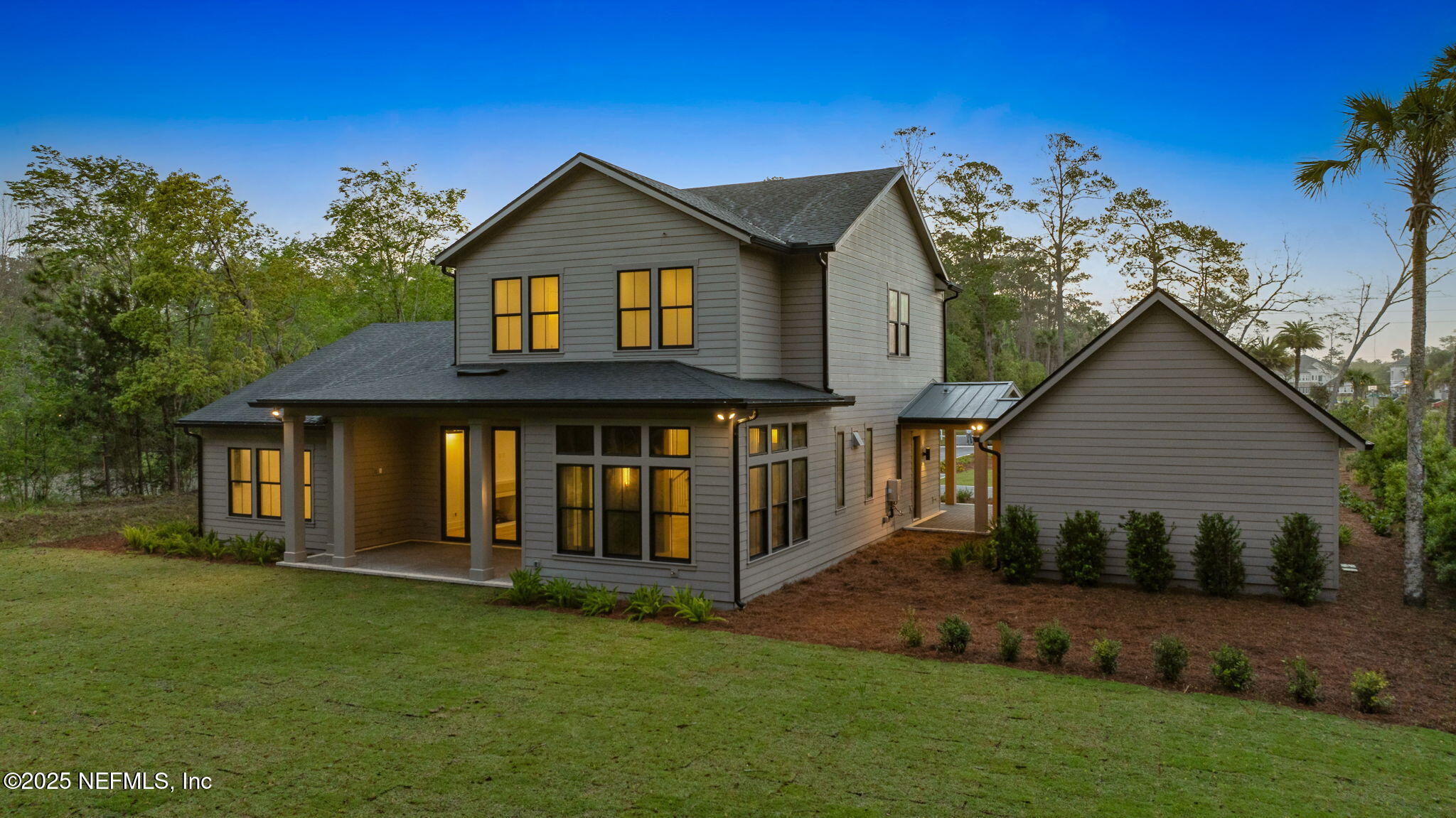 4650 Palm Valley Road Ponte Vedra Beach, FL 32082 - Photo 64 of 80 a view of a house with a yard and potted plants