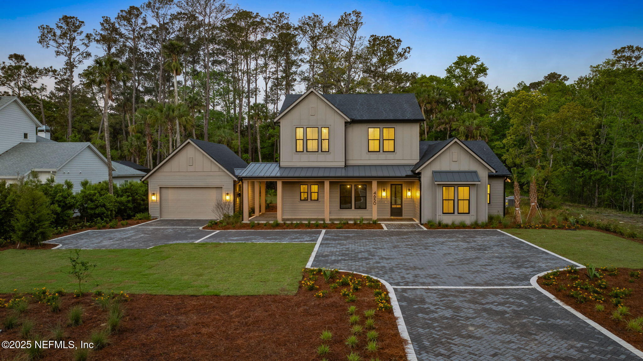 4650 Palm Valley Road Ponte Vedra Beach, FL 32082 - Photo 67 of 80 a front view of a house with a yard and garage