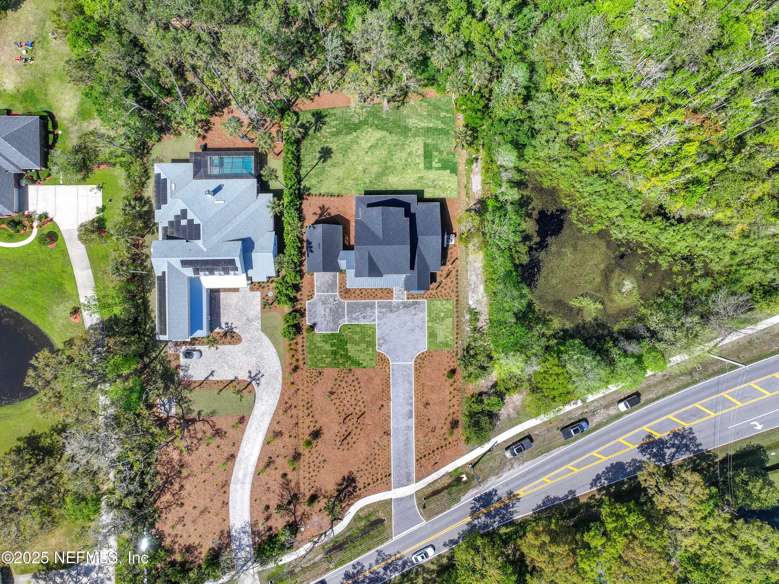4650 Palm Valley Road Ponte Vedra Beach, FL 32082 - Photo 74 of 80 an aerial view of a house with a yard