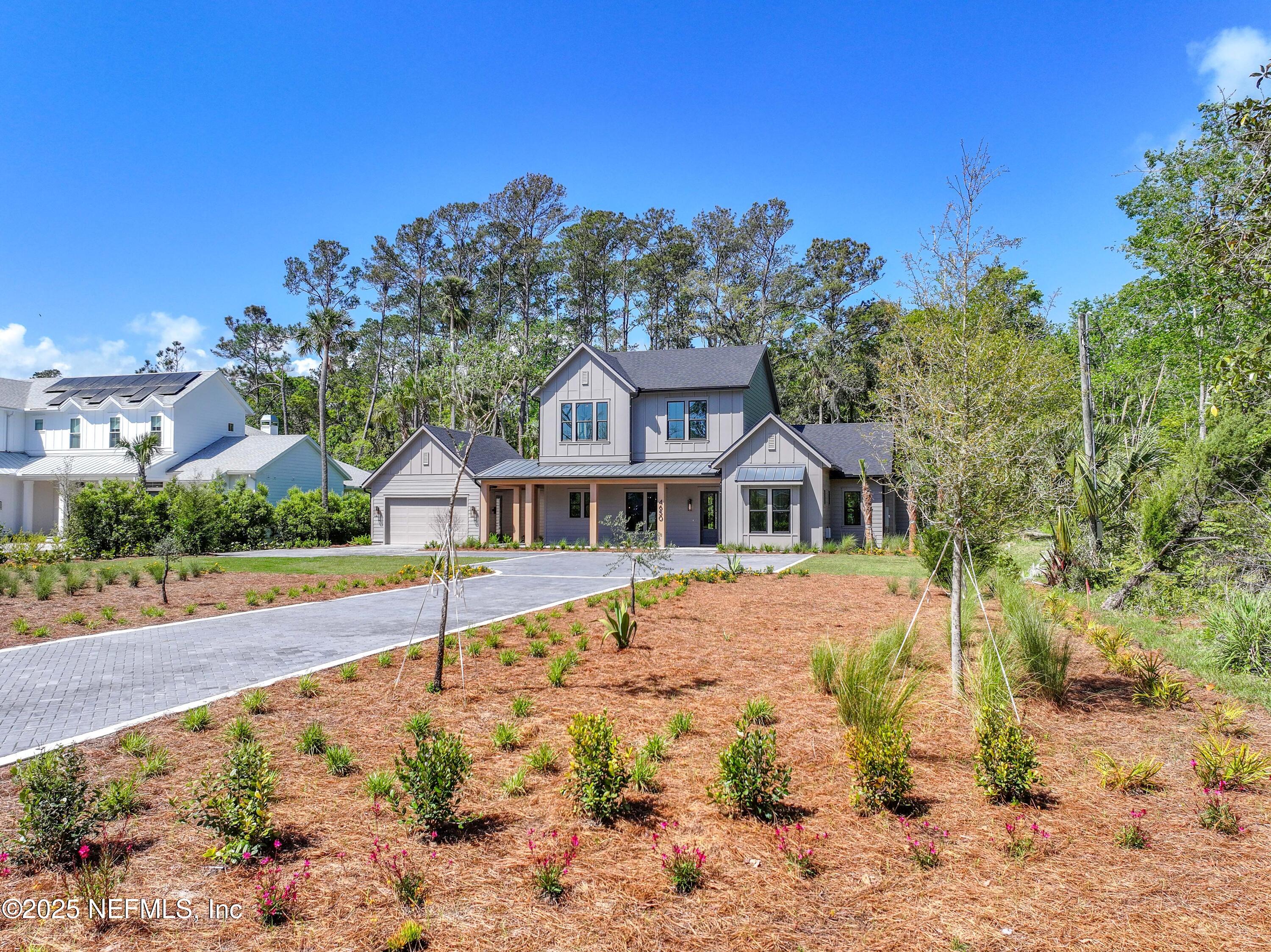 4650 Palm Valley Road Ponte Vedra Beach, FL 32082 - Photo 75 of 80 a front view of a house with a yard