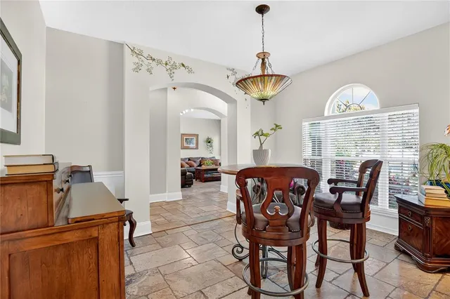 a view of a dining room with furniture window and outside view