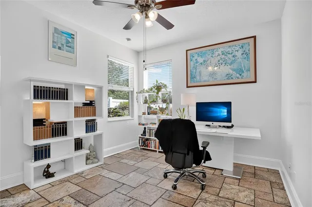 a work room with furniture and a window