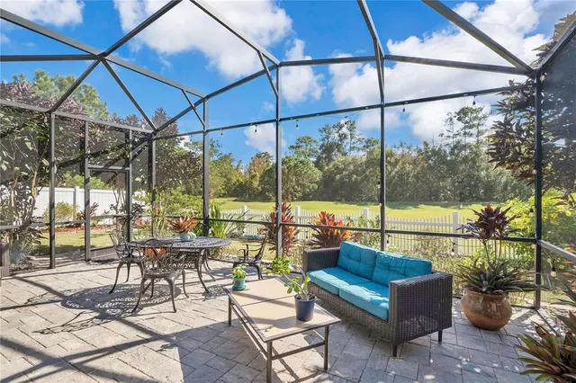 a view of a two chairs in the patio