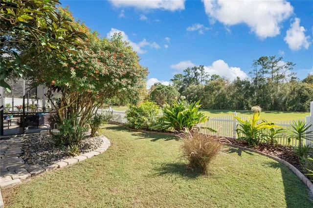 a view of a swimming pool with an outdoor space and seating area
