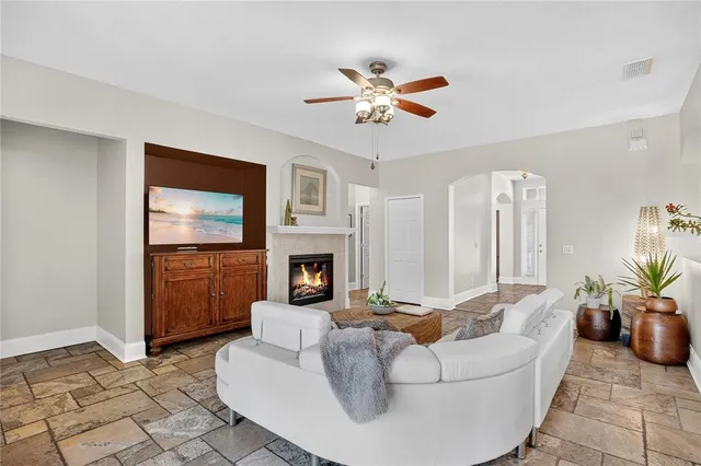 a living room with furniture and a fireplace