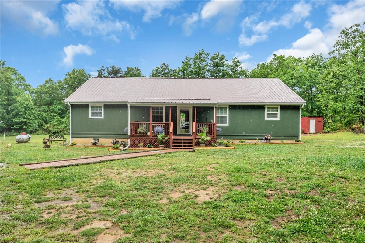 802 Meyers Road Altamont, TN 37301 - Photo 1 of 30 a view of a house with a yard patio and a tree