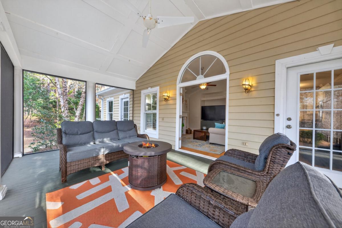 1091 Maple Ridge Way Greensboro, GA 30642 - Photo 11 of 52 a living room with furniture and a large window