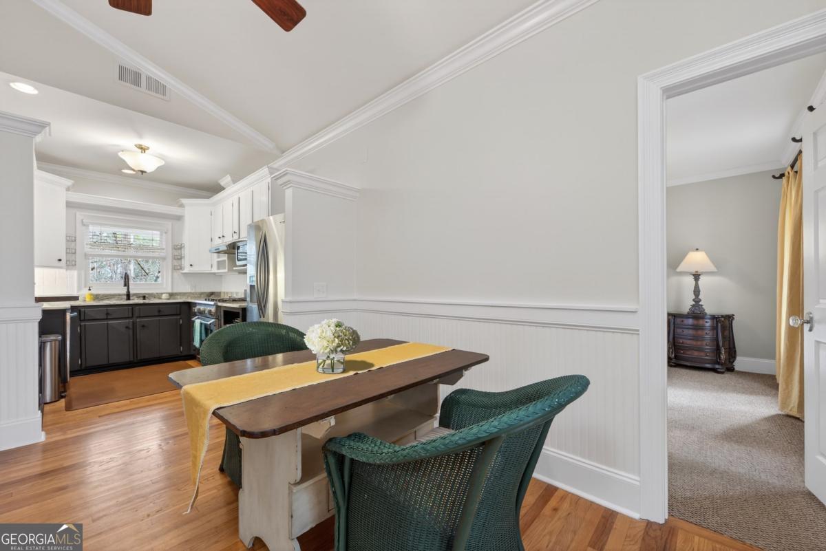 1091 Maple Ridge Way Greensboro, GA 30642 - Photo 16 of 52 a view of a dining room with furniture and wooden floor