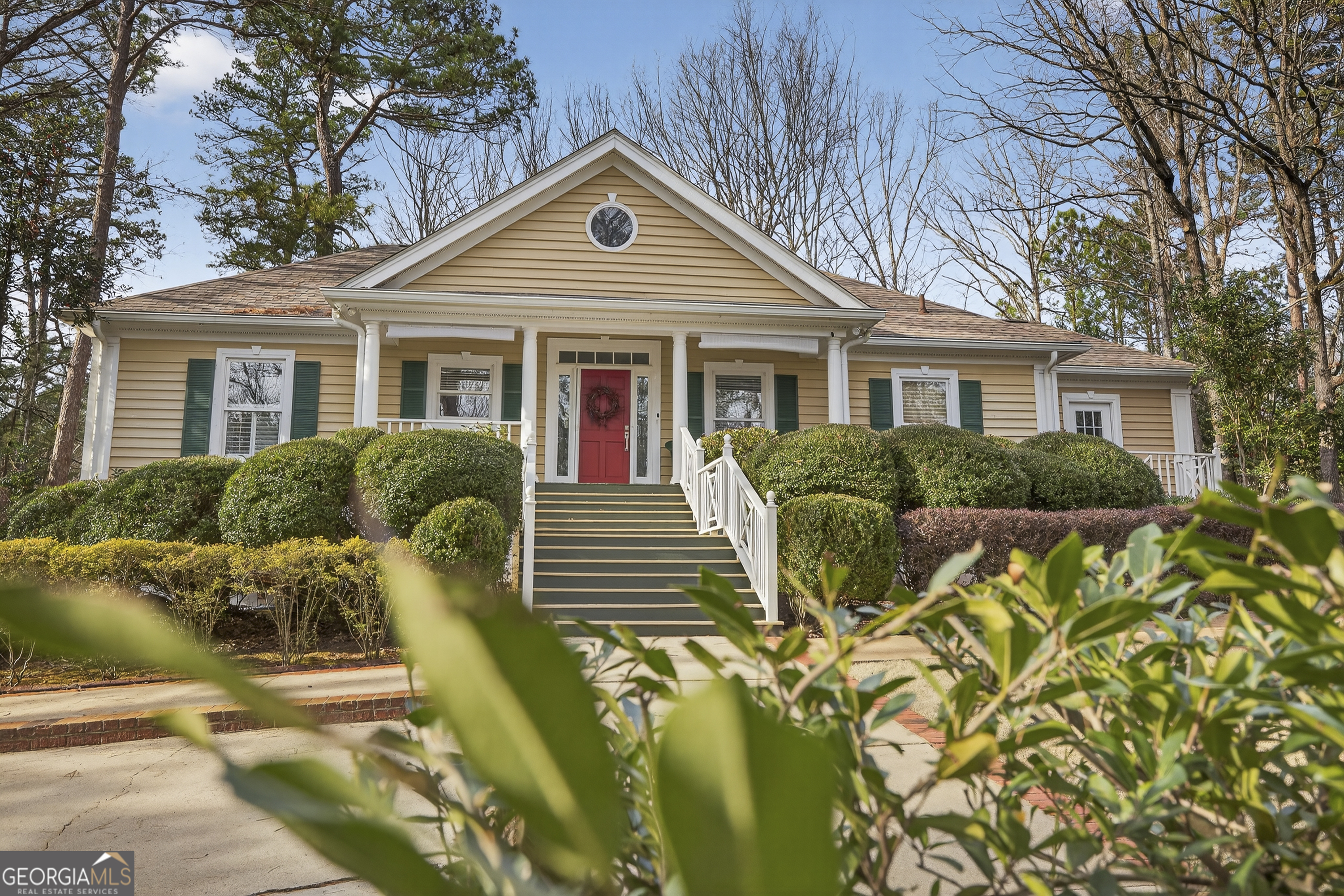 1091 Maple Ridge Way Greensboro, GA 30642 - Photo 2 of 52 a front view of a house with balcony
