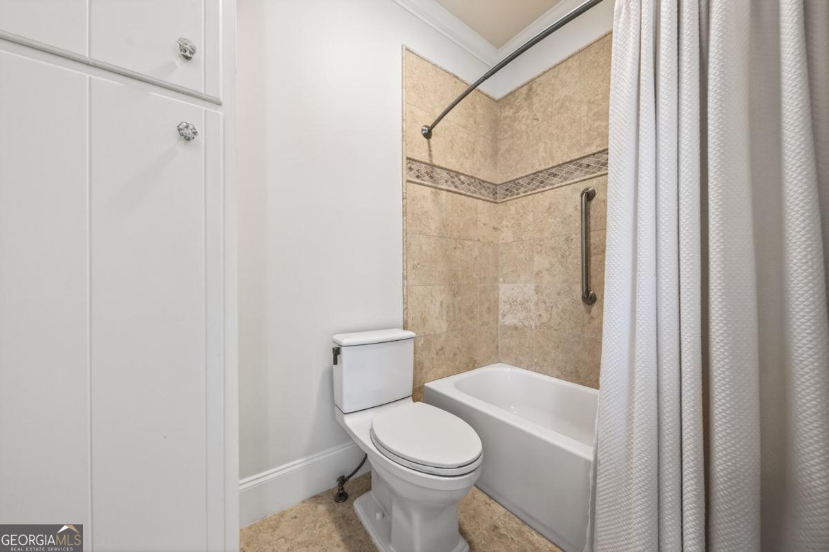 1091 Maple Ridge Way Greensboro, GA 30642 - Photo 22 of 52 a bathroom with a toilet and a shower