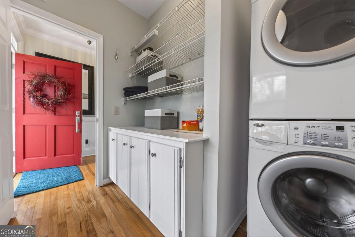 1091 Maple Ridge Way Greensboro, GA 30642 - Photo 32 of 52 a view of a hallway with washer and dryer