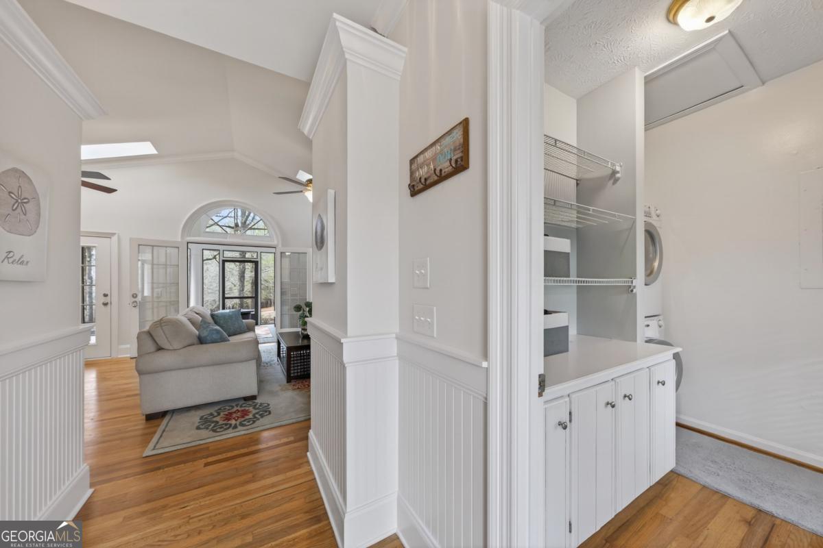 1091 Maple Ridge Way Greensboro, GA 30642 - Photo 33 of 52 a living room with furniture and wooden floor