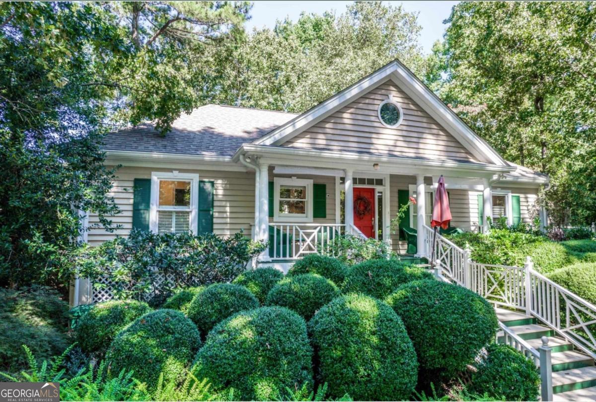 1091 Maple Ridge Way Greensboro, GA 30642 - Photo 4 of 52 a view of a yard in front of house