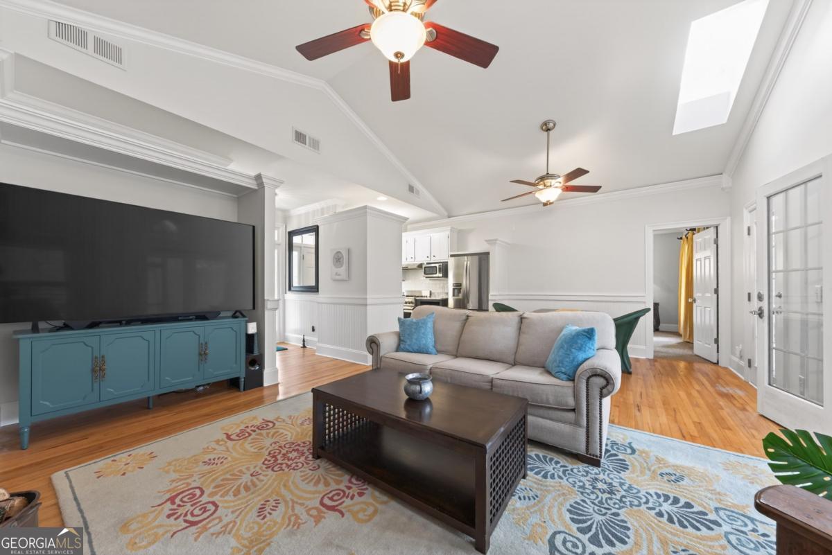 1091 Maple Ridge Way Greensboro, GA 30642 - Photo 8 of 52 a living room with furniture and a flat screen tv