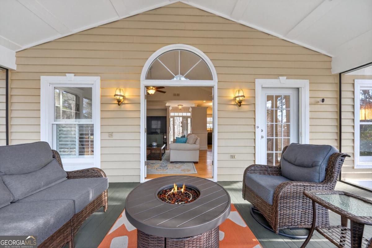 1091 Maple Ridge Way Greensboro, GA 30642 - Photo 10 of 52 a living room with furniture a rug and a window