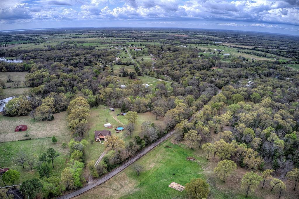 811 County Road 4250 Point, TX 75472 - Photo 12 of 38 Private country retreat with multiple storage sheds, an above-ground pool with new decking, hot tub, and a private RV hookup with its own septic and electric meter.