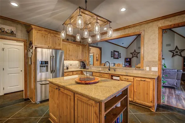 a kitchen with a sink stove and refrigerator