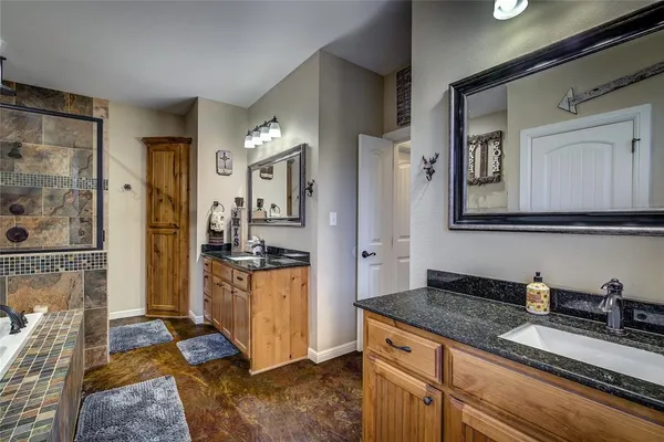 a kitchen with stainless steel appliances granite countertop a refrigerator and a stove