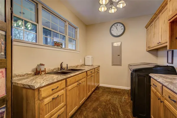 a kitchen with a stove and a clock