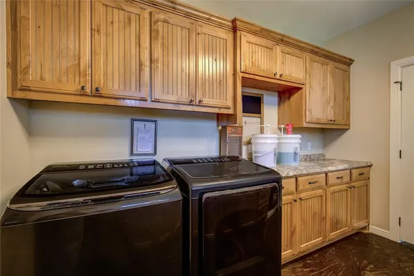 a kitchen with granite countertop cabinets stainless steel appliances and a sink