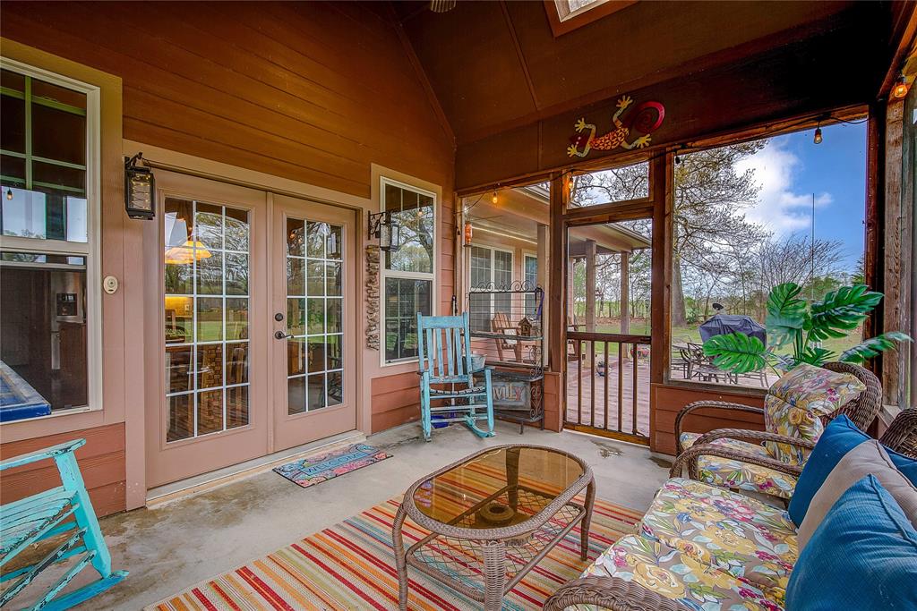 811 County Road 4250 Point, TX 75472 - Photo 32 of 38 Large screened-in back porch measuring 14’1” x 11’7”, perfect for relaxing and enjoying the outdoors.