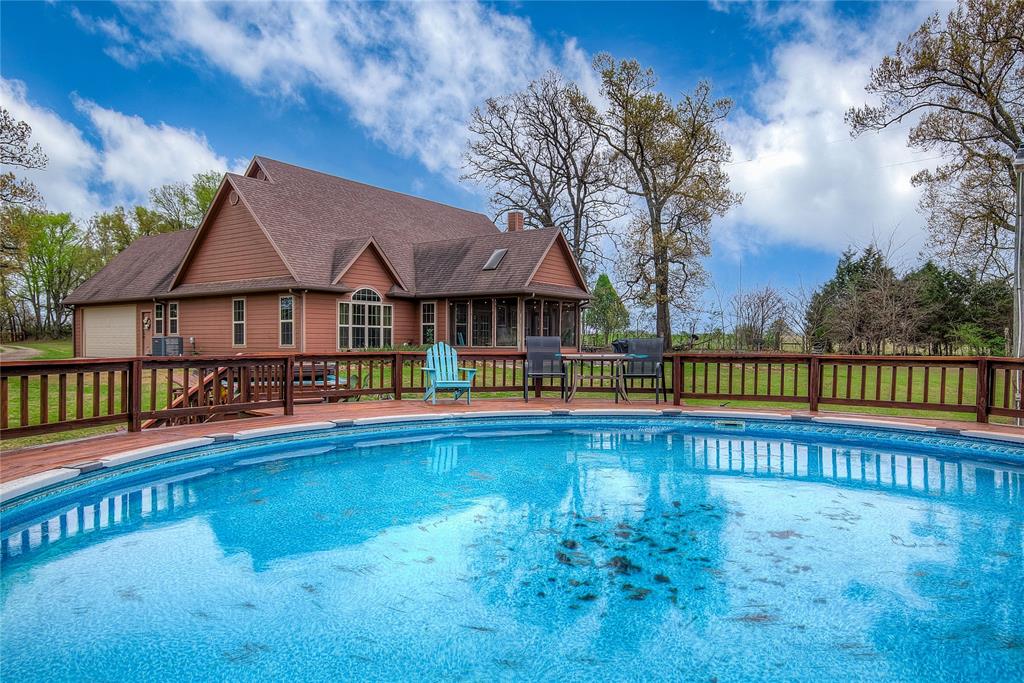 811 County Road 4250 Point, TX 75472 - Photo 36 of 38 View of the swimming pool with updated decking and a relaxing hot tub.