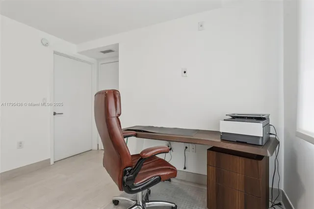 a view of a hallway with washer and dryer