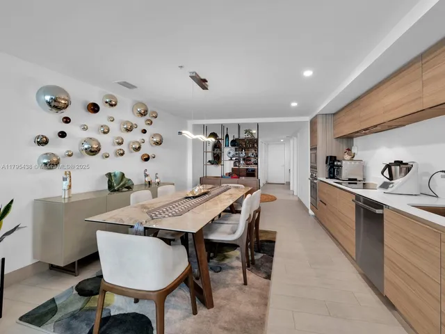 a living room with furniture a rug and white walls