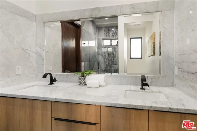 a bedroom with a bed and a mirror