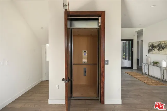 a bedroom with a large bed and a large window