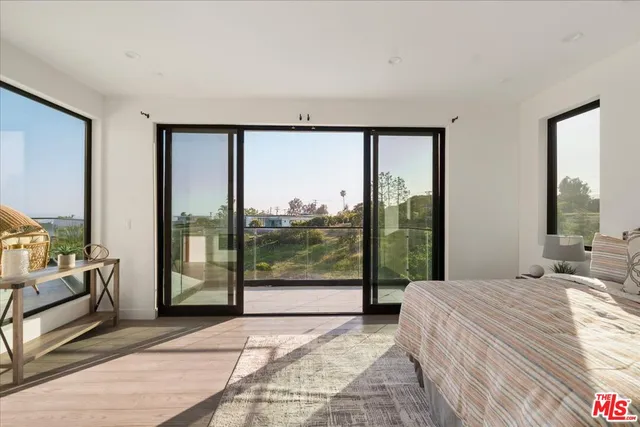 a bathroom with a granite countertop sink and a large mirror