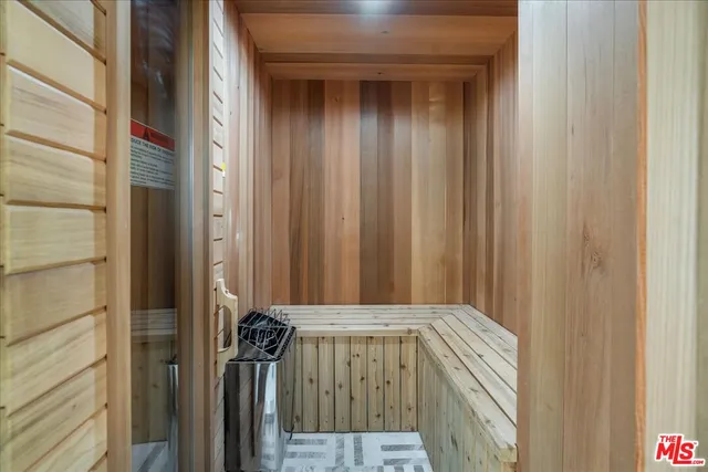 a living room with furniture and large windows