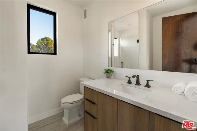 a kitchen with counter top space sink and refrigerator