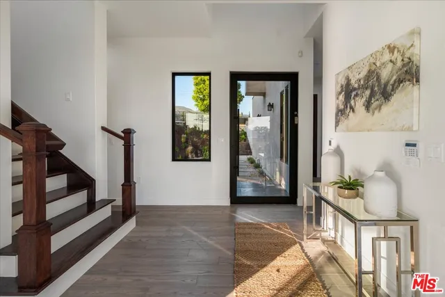 an aerial view of a house with a lake view