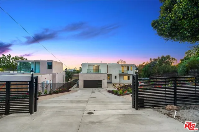 a living room with fireplace furniture and a chandelier