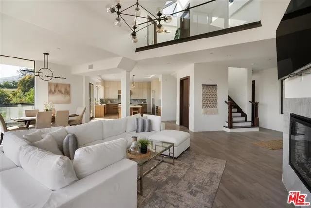 a open kitchen with stainless steel appliances granite countertop a sink stove and refrigerator